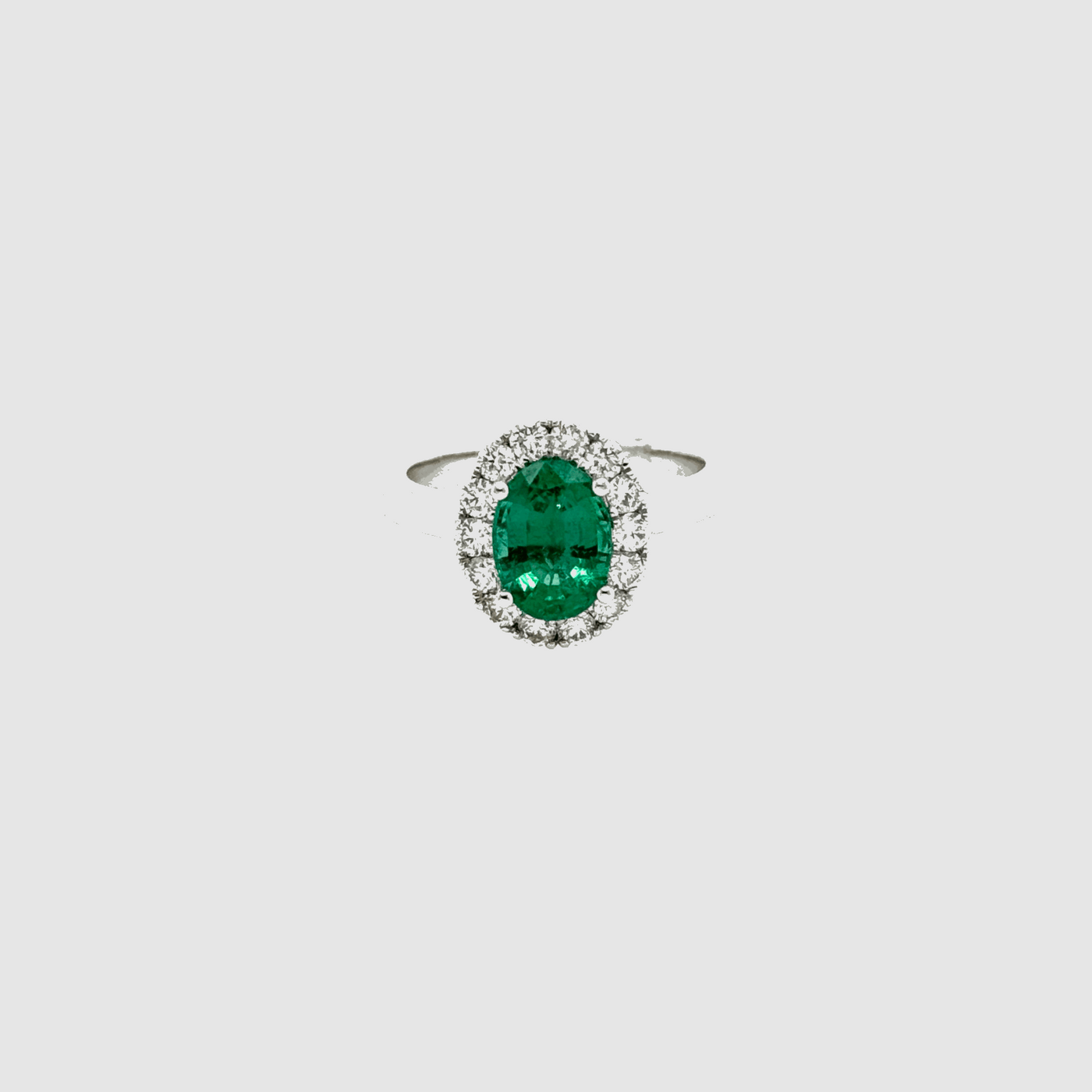 18ct White Gold Emerald and Diamond Halo Ring