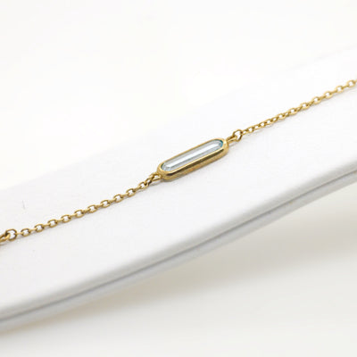 9ct Yellow Gold Bracelet with Four Oblong Blue Topaz Stations